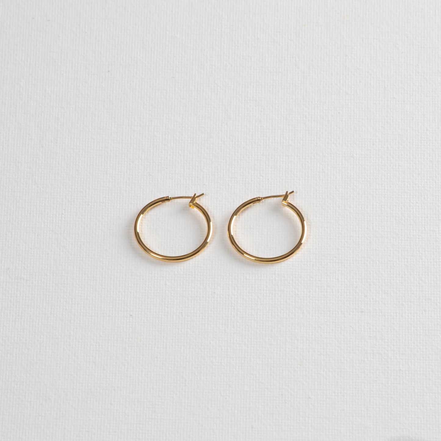 Jane hoops photographed on a white background on a slight angle from the bottom.