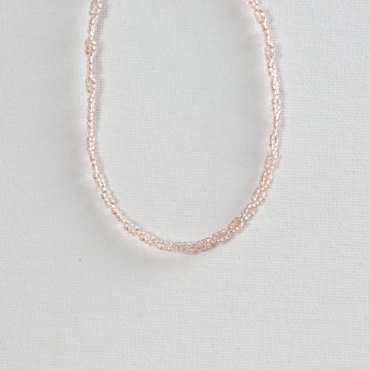 Infinity pattern beaded choker showcased on a clean white background.