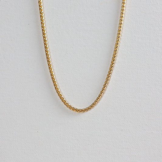 Remy, wheat chain necklace, placed on a white background.