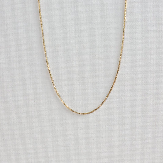 Baby box chain necklace photographed on a white background.